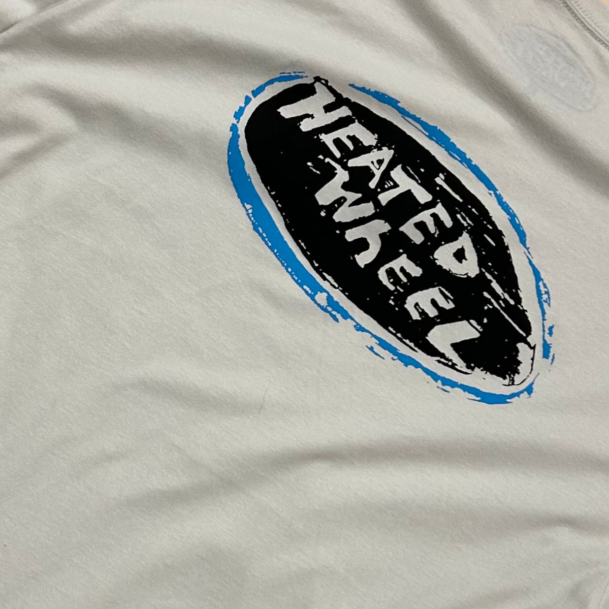 The Heated Wheel - Oval Tee