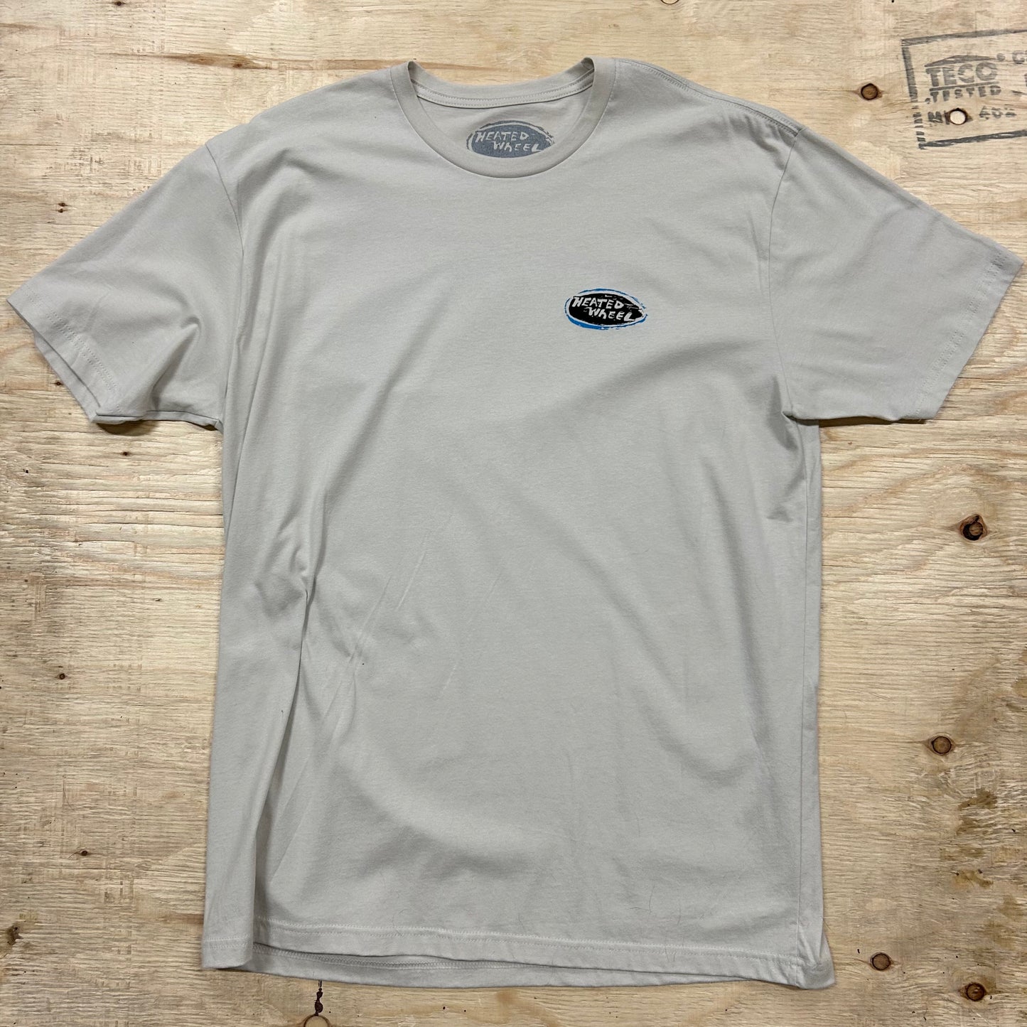 The Heated Wheel - Oval Tee