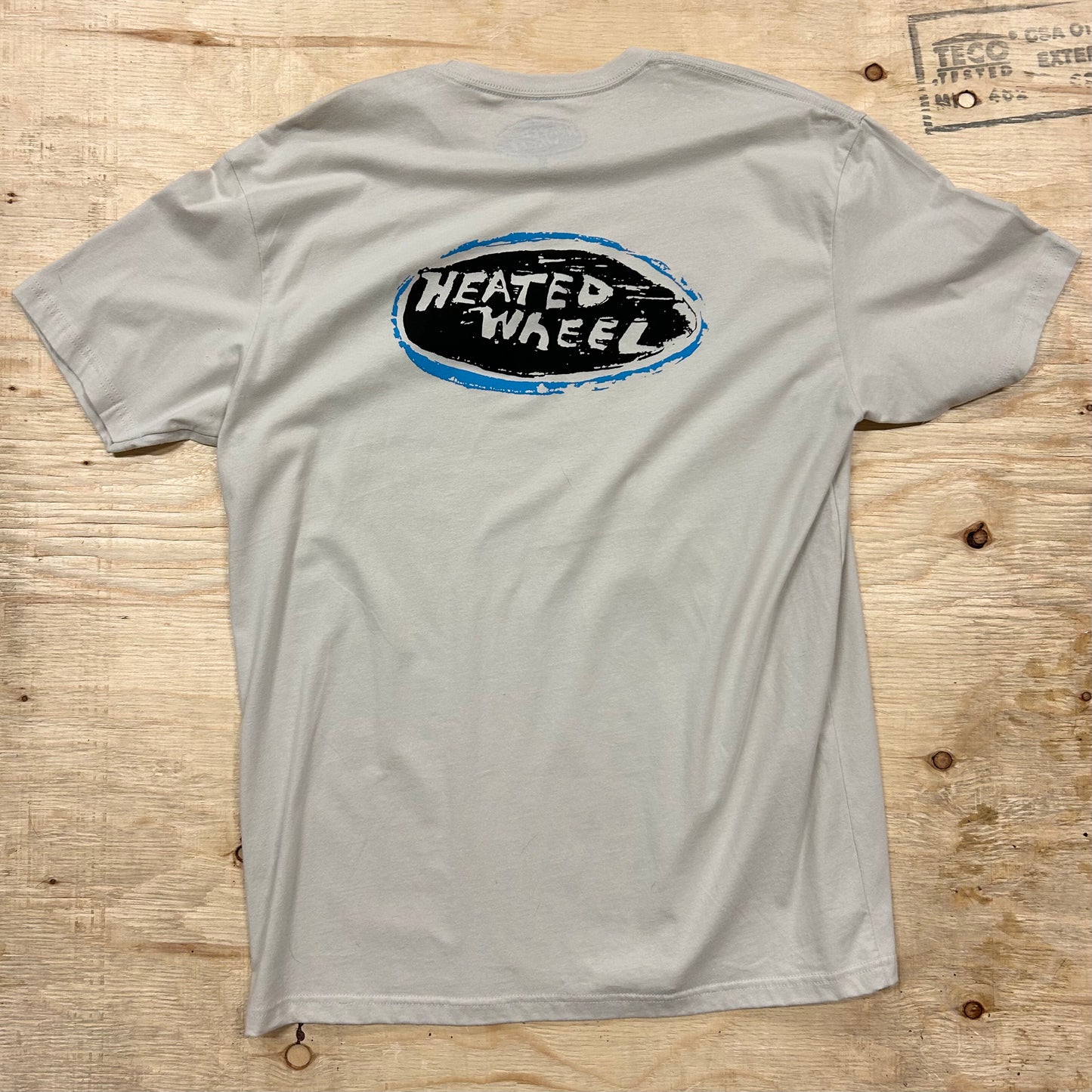 The Heated Wheel - Oval Tee